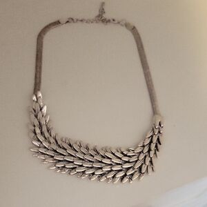 Elegant Silver Tone Intertwined Feather Statement Necklace extender claw clasp